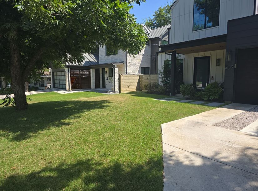 Healthy green front lawn at a modern Austin home