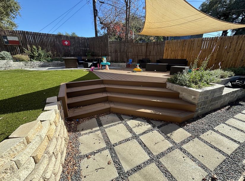 Composite deck with wraparound steps in an Austin backyard