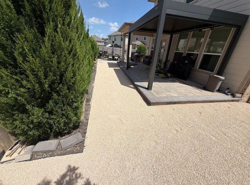 Aluminum louvered pergola over a paver patio in an Austin backyard