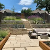 Retaining wall and terraced landscaping in an Austin backyard