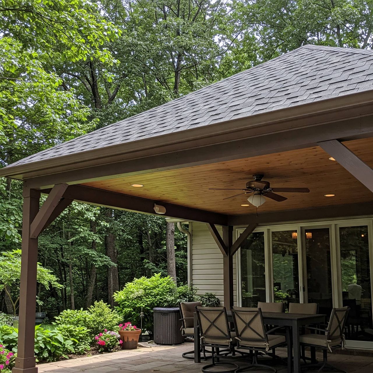 Covered patio with ceiling fans and lights in Austin