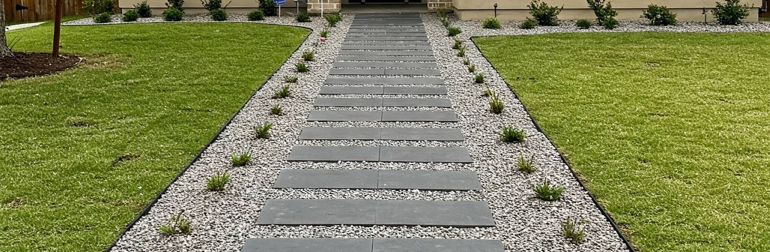 Custom drainage system design and installation in Austin yard