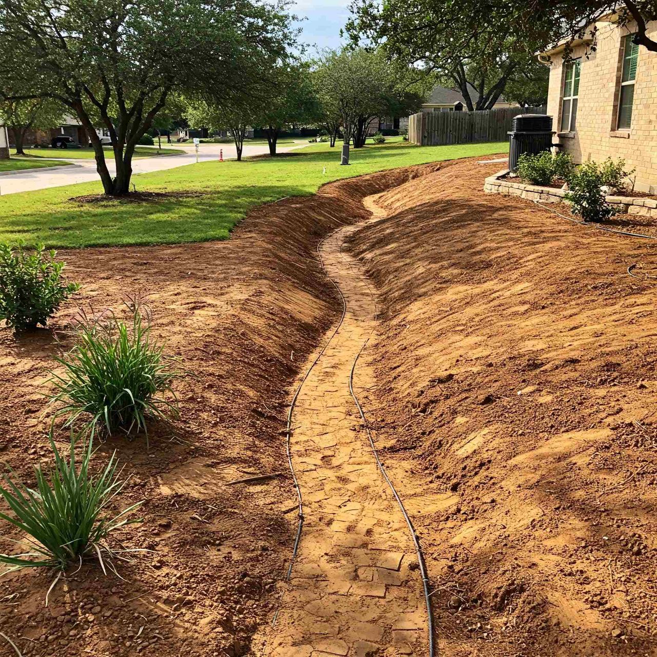 Yard grading and re-grading for drainage in Austin