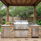 Custom outdoor kitchen with stone countertops in an Austin backyard