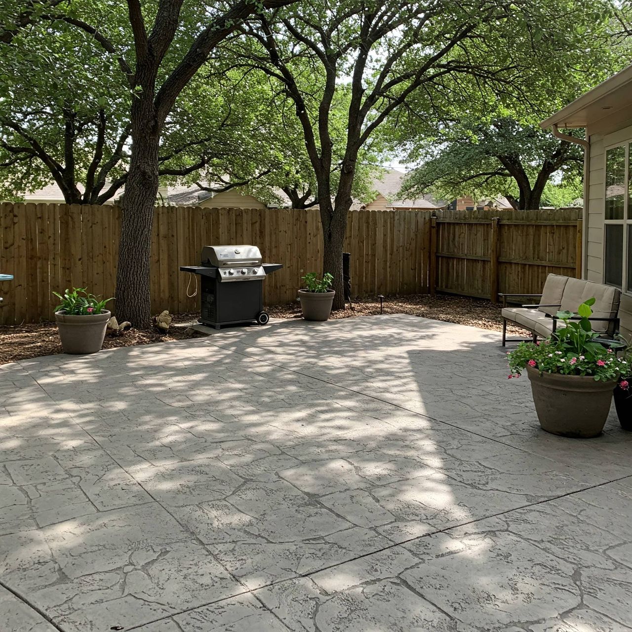 Decorative stamped concrete overlay on Austin patio