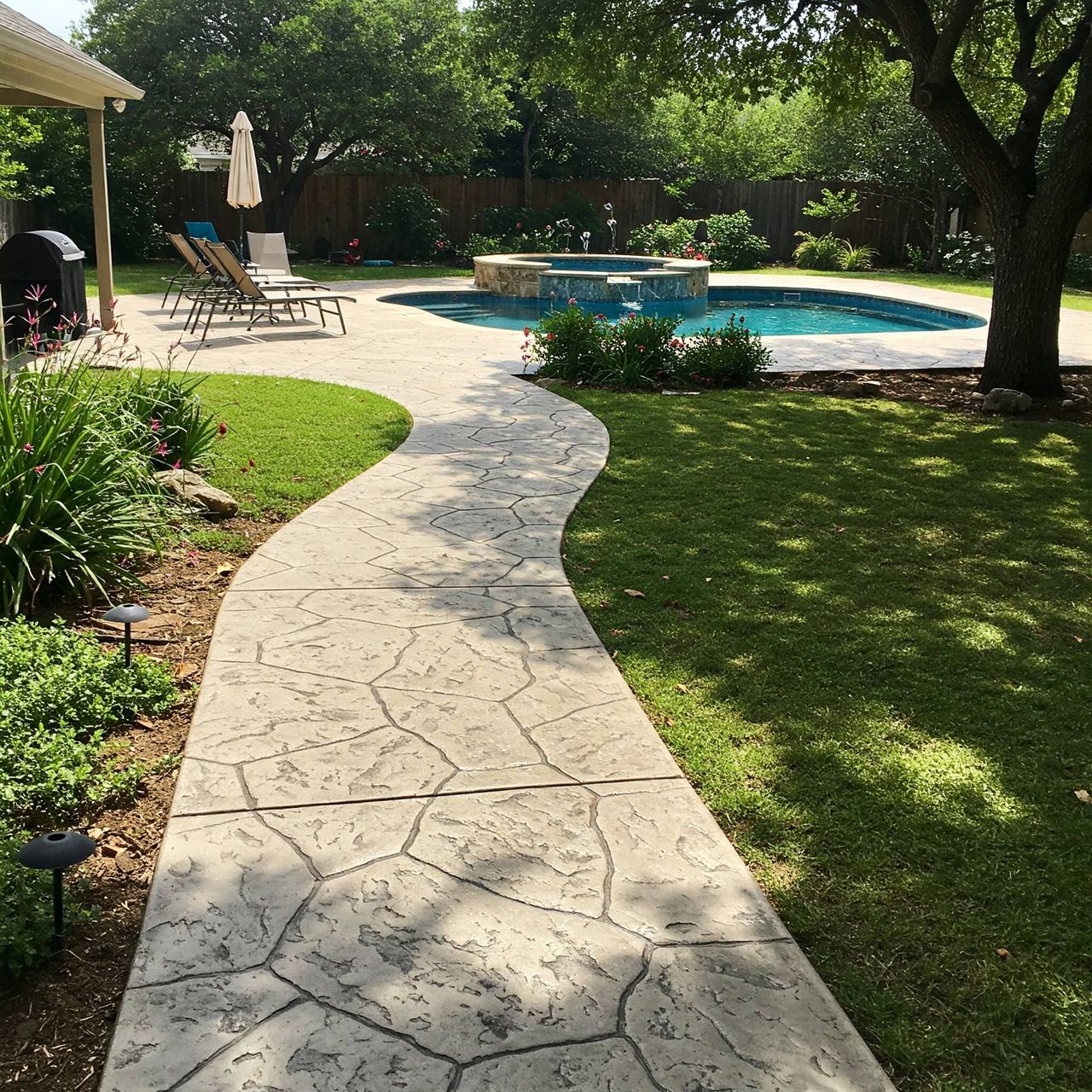 Driveway and walkway resurfacing with concrete overlay in Austin