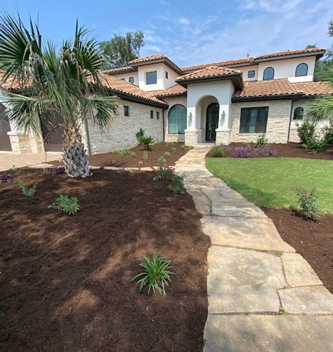 Natural stone front walkway leading to the entrance of an Austin home