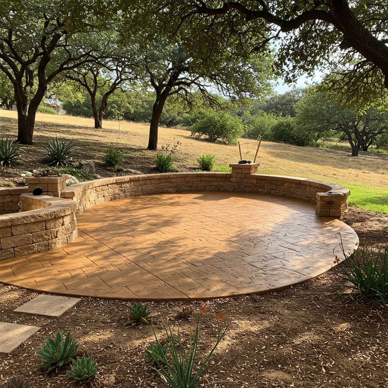 Stone borders, steps, and seating walls on an Austin patio