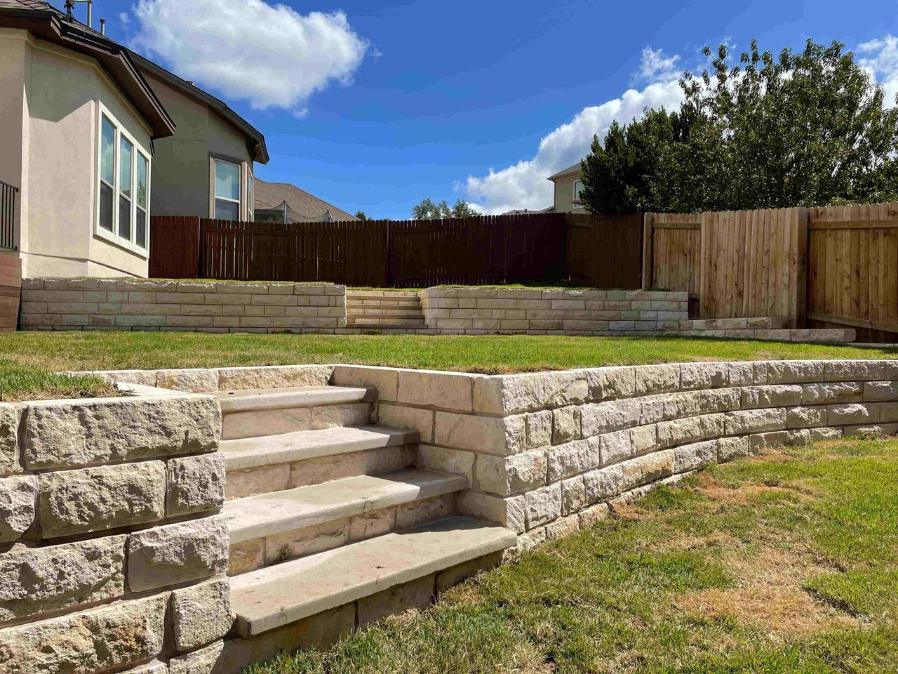Tiered retaining wall and raised bed system in Austin