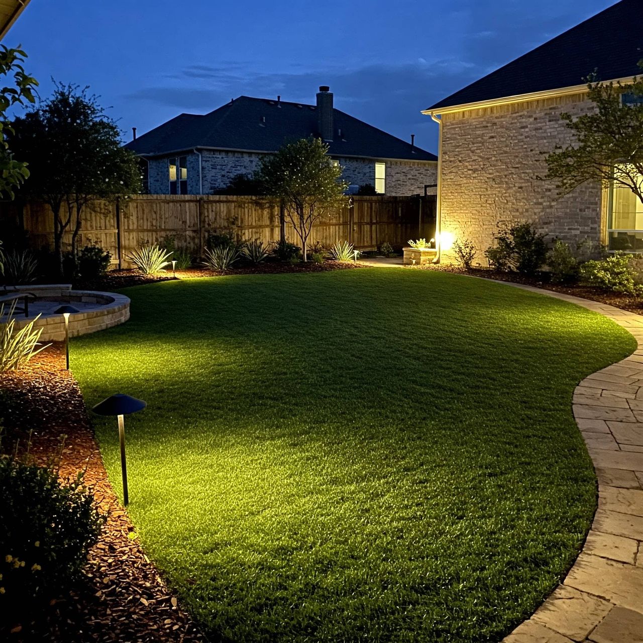 Landscape lighting and turf accent integration in Austin