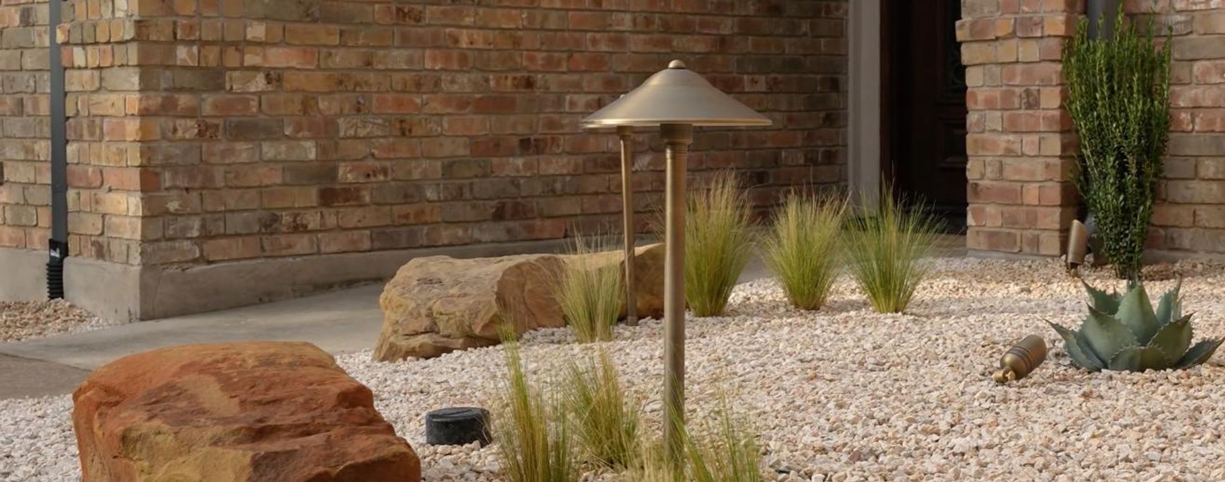 Indigo landscape design project featuring pathway lighting and native plants in Austin