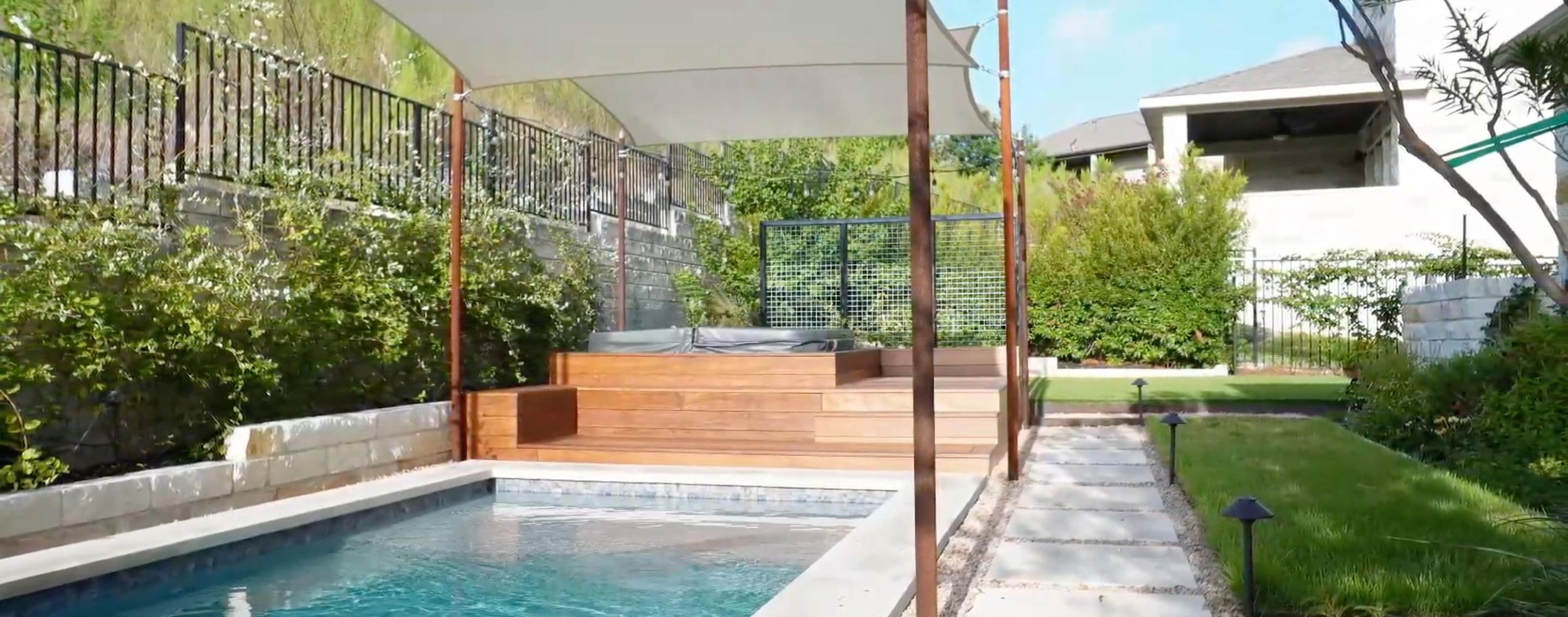 Balvadino Skyway outdoor living project with pool deck and shade sail in Austin