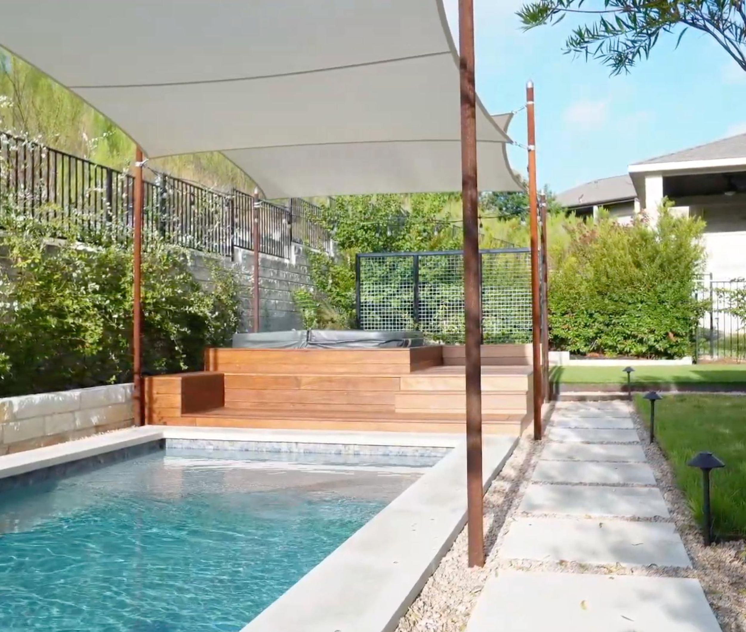 Balvadino Skyway outdoor living project with pool deck and shade sail in Austin