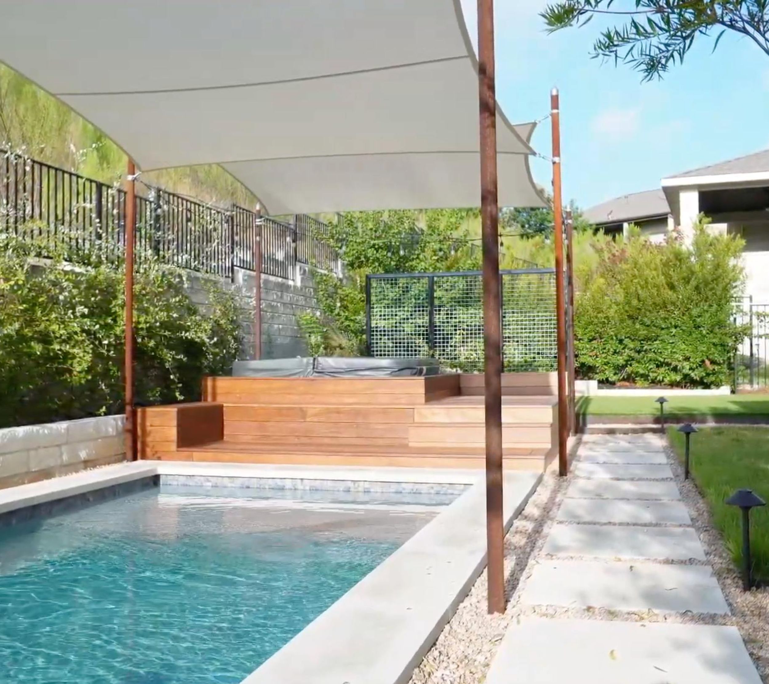Balvadino Skyway outdoor living project with pool deck and shade sail in Austin