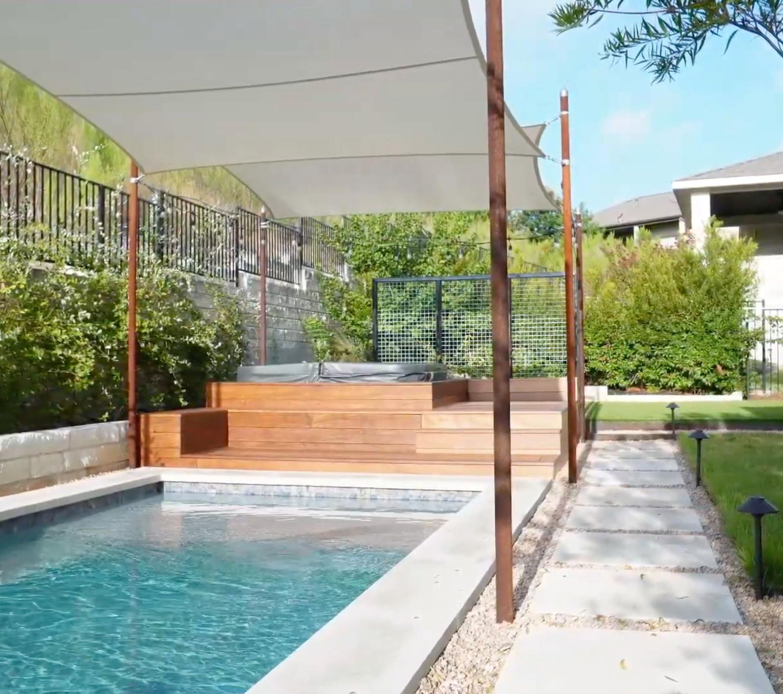 Balvadino Skyway outdoor living project with pool deck and shade sail in Austin