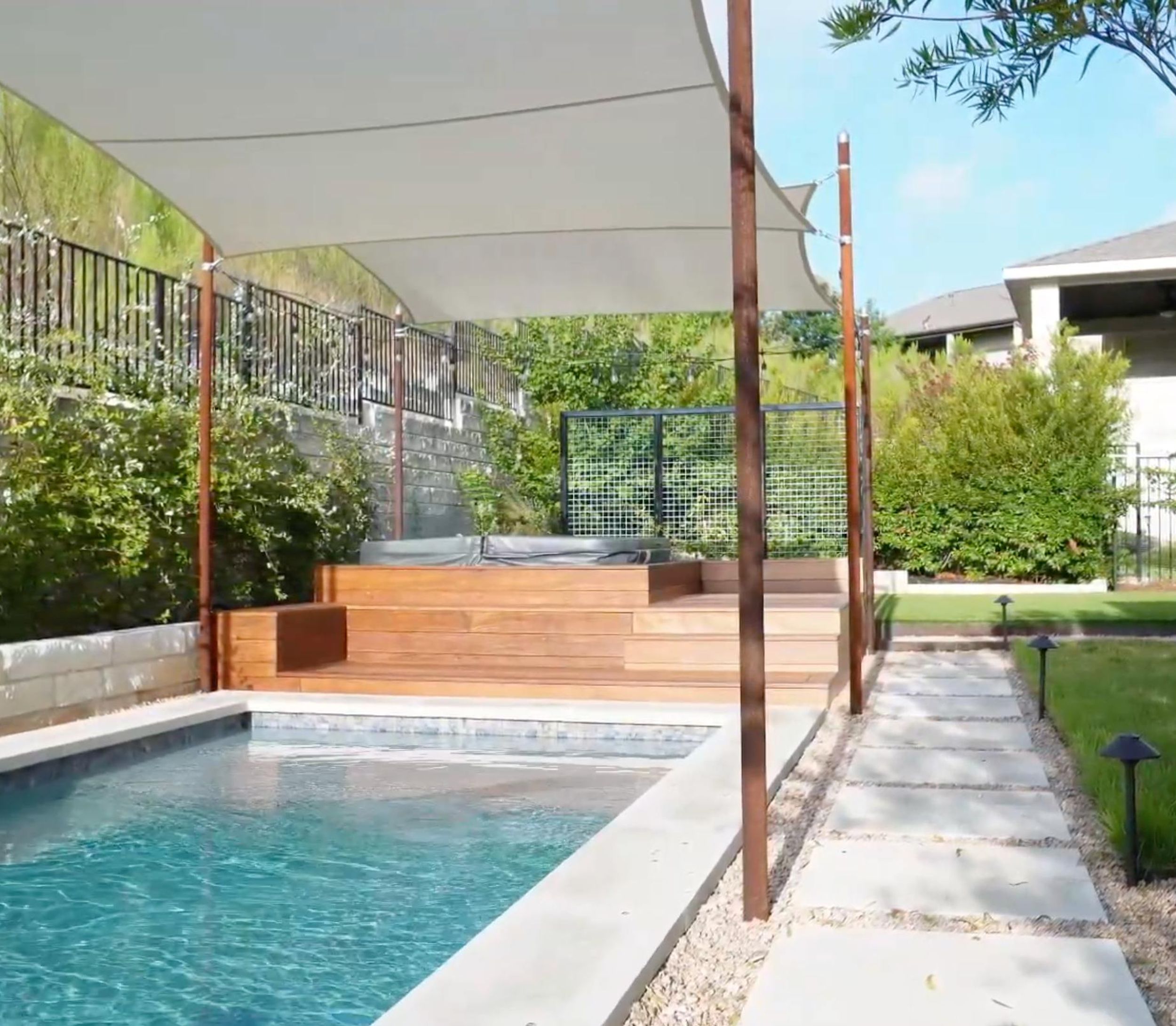 Balvadino Skyway outdoor living project with pool deck and shade sail in Austin