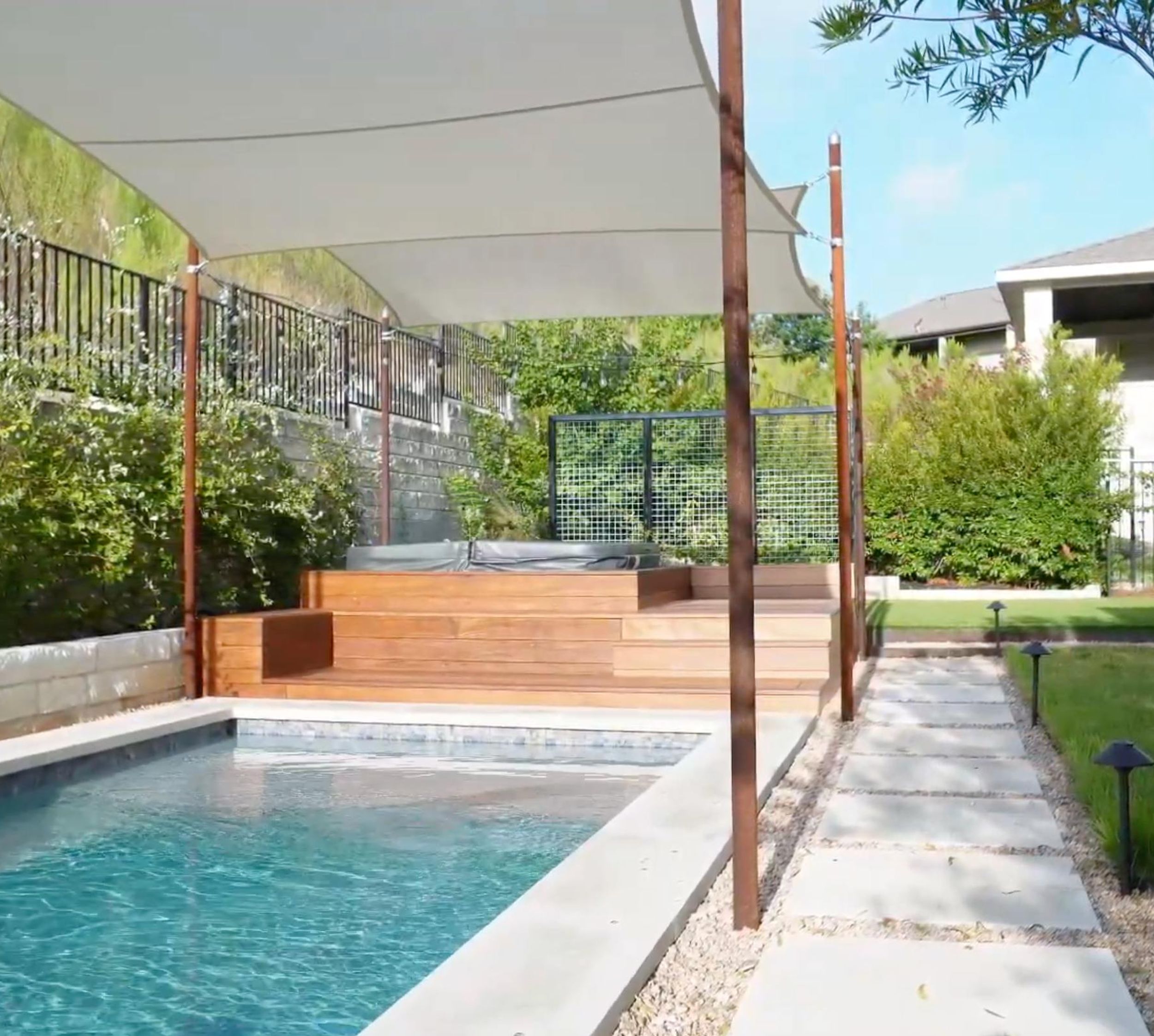 Balvadino Skyway outdoor living project with pool deck and shade sail in Austin