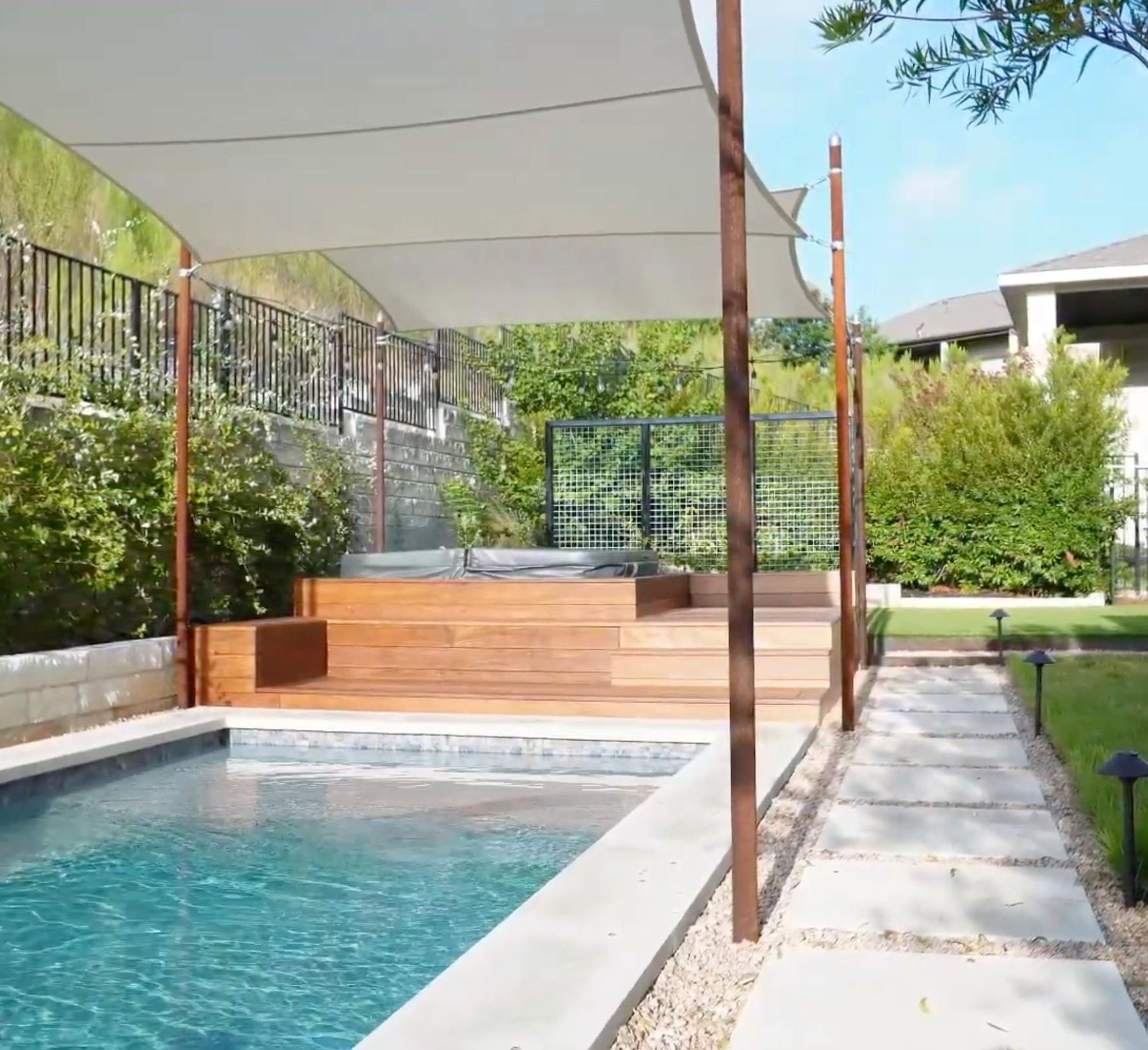 Balvadino Skyway outdoor living project with pool deck and shade sail in Austin