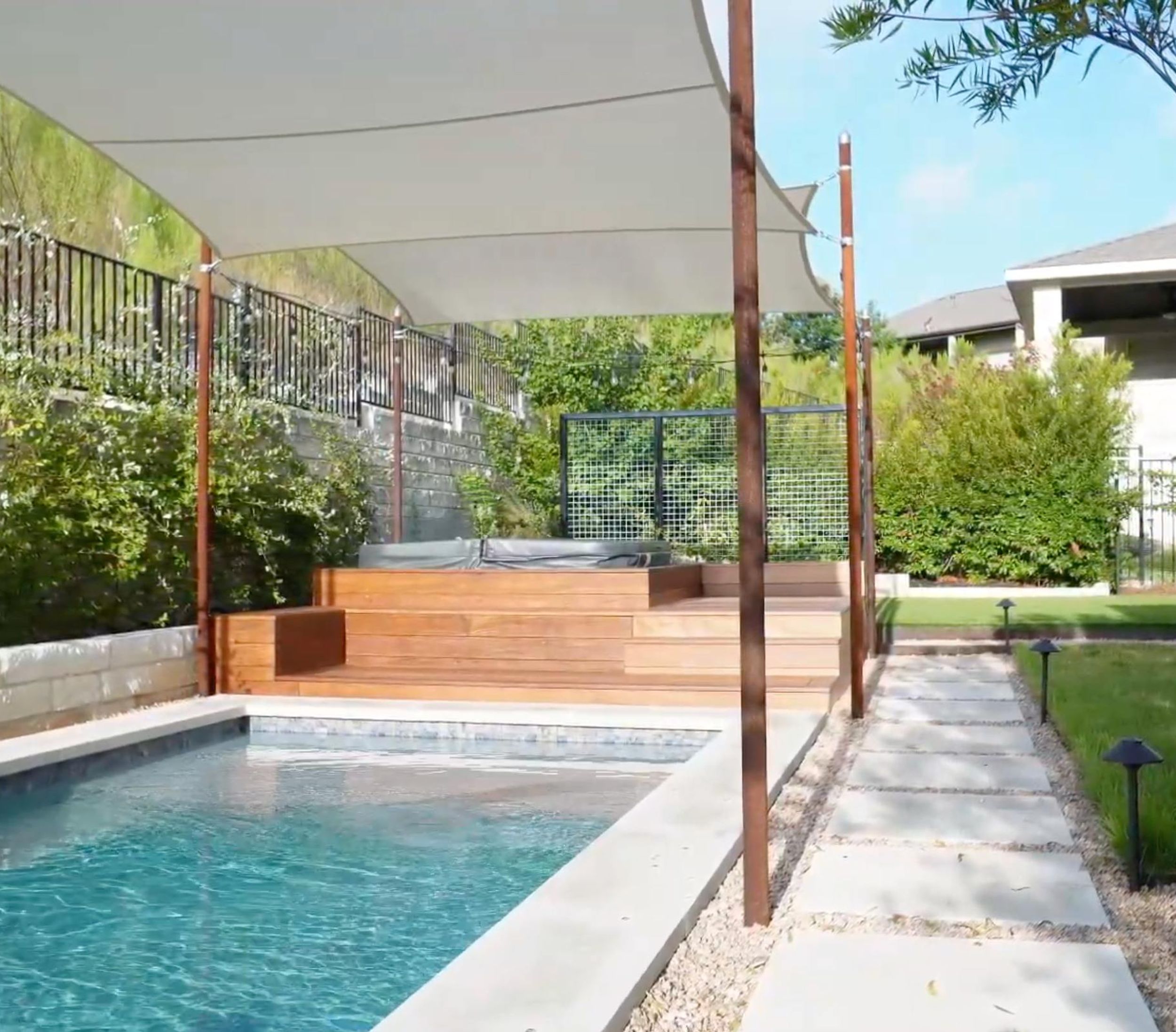 Balvadino Skyway outdoor living project with pool deck and shade sail in Austin
